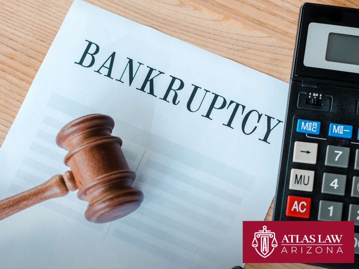 Gavel, calculator, and bankruptcy document representing legal assistance for Debt Relief at Atlas Law Arizona